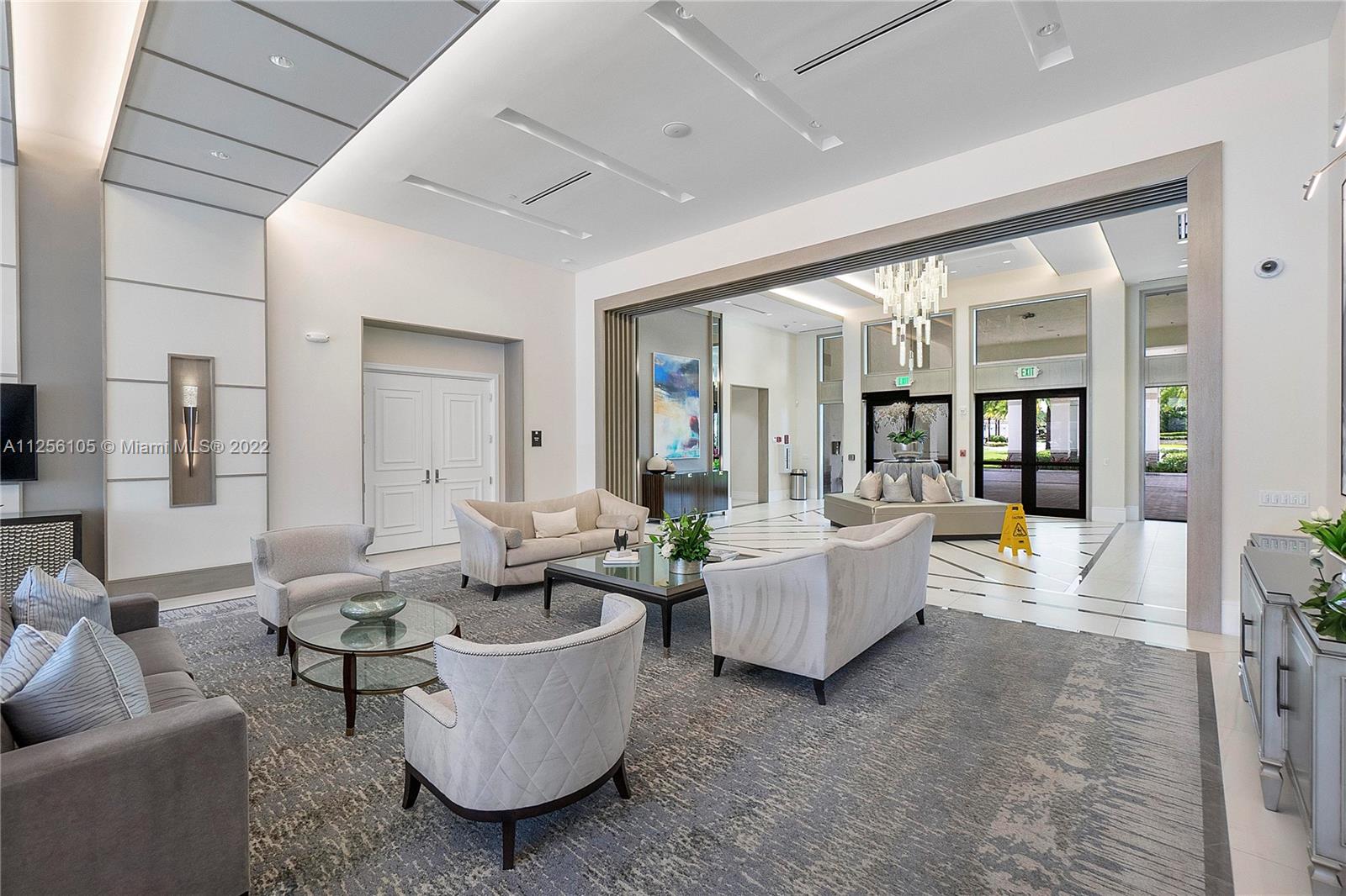 7677 Doubleton Drive Delray Beach, FL 33446 - Photo 40 of 42 a living room with furniture and a large window