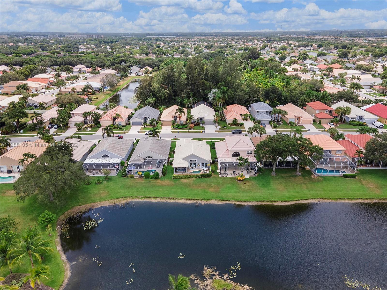 7677 Doubleton Drive Delray Beach, FL 33446 - Photo 5 of 42 an aerial view of a house with outdoor space and street view