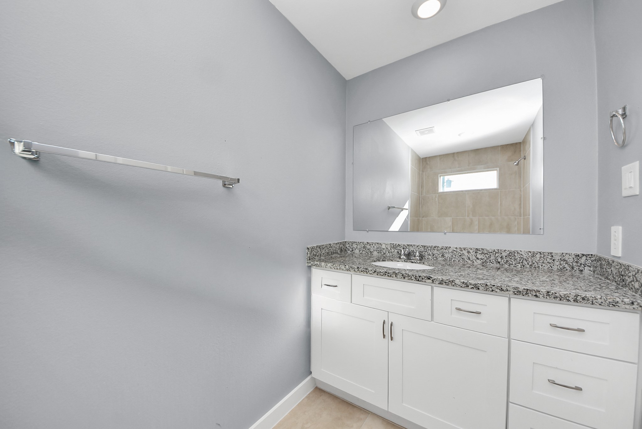618 Maple Way, Unit A Houston, TX 77015 - Photo 33 of 48 a bathroom with a granite countertop sink and a mirror