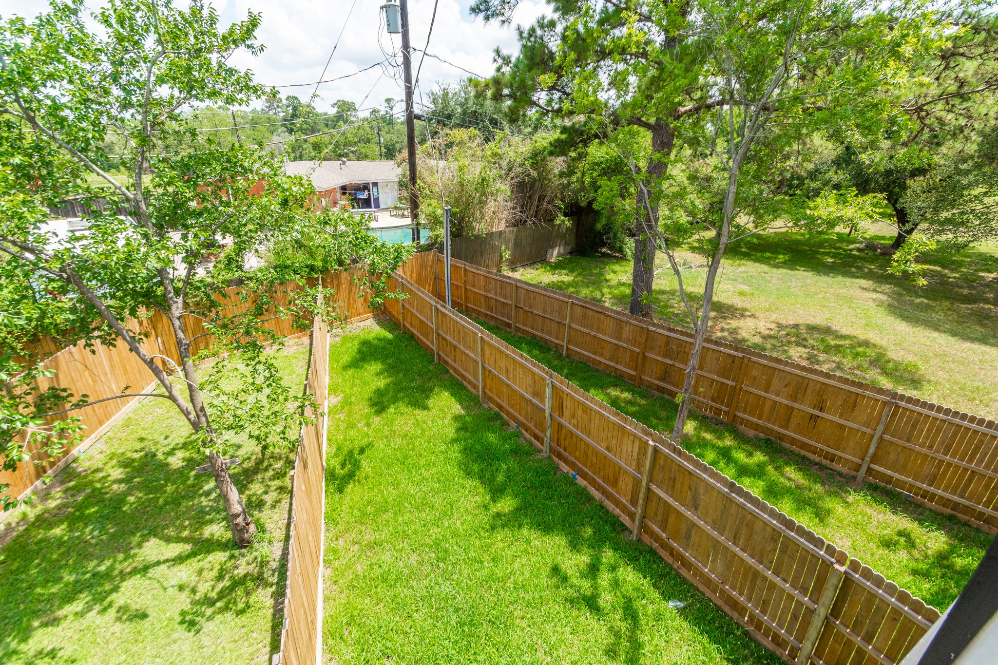 618 Maple Way, Unit A Houston, TX 77015 - Photo 47 of 48 a view of a yard with large trees