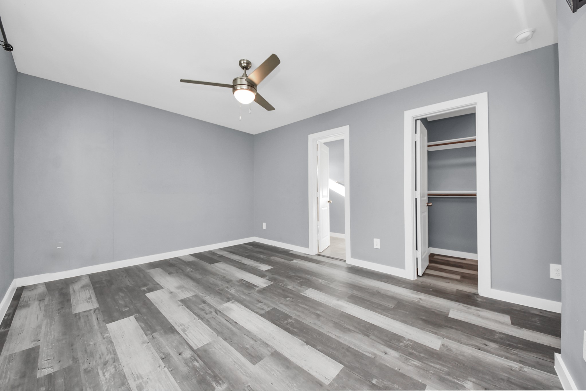 618 Maple Way, Unit A Houston, TX 77015 - Photo 6 of 48 a view of empty room with wooden floor and ceiling fan