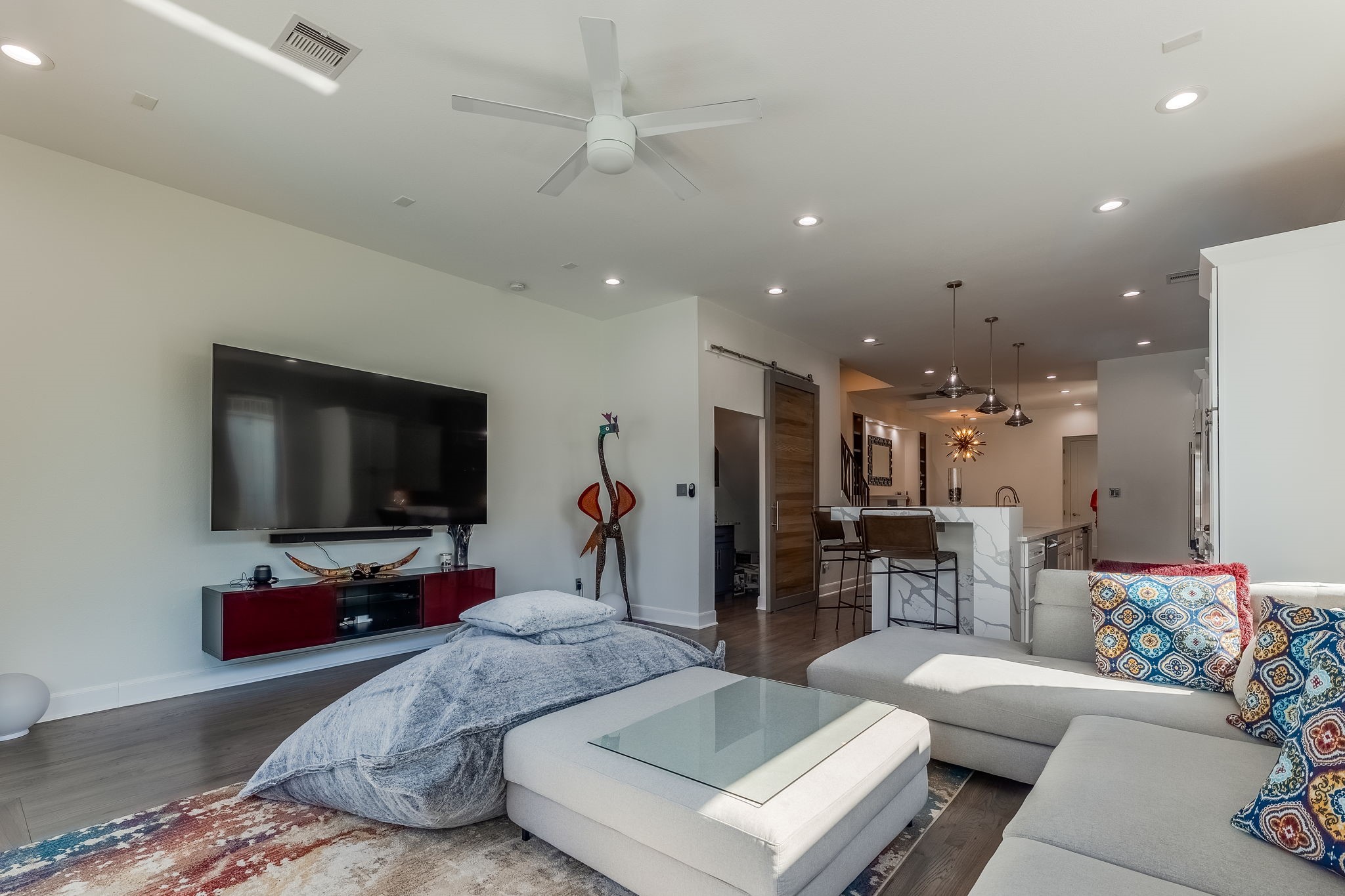 2124 Banks Street Houston, TX 77098 - Photo 18 of 46 a living room with furniture and a flat screen tv