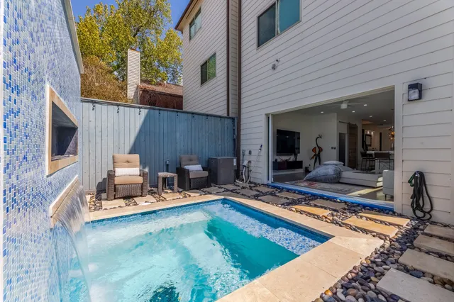 a view of swimming pool with outdoor seating
