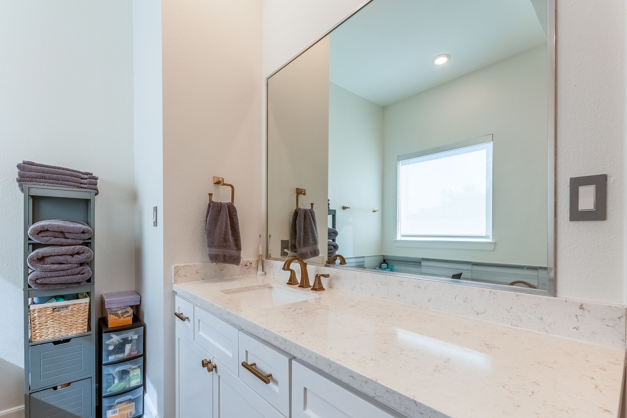 2124 Banks Street Houston, TX 77098 - Photo 35 of 46 a bathroom with a sink and a mirror