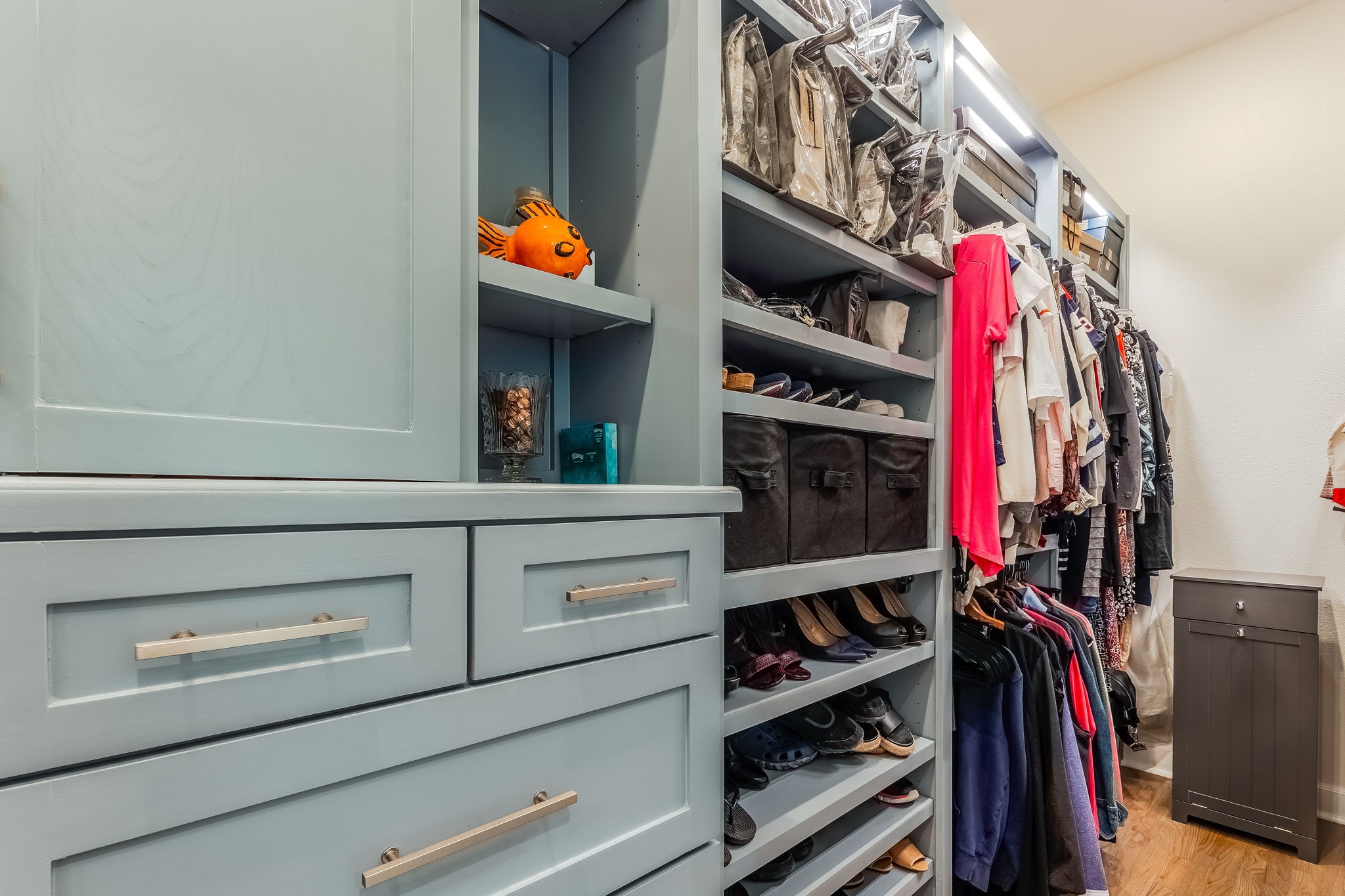 2124 Banks Street Houston, TX 77098 - Photo 39 of 46 a view of walk in closet with clothes and shoes