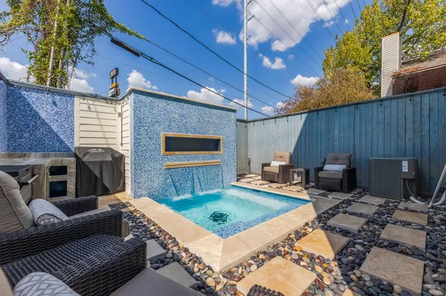 a living room with furniture and a rug