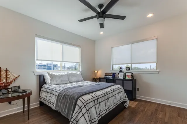 a bedroom with a large bed and a window