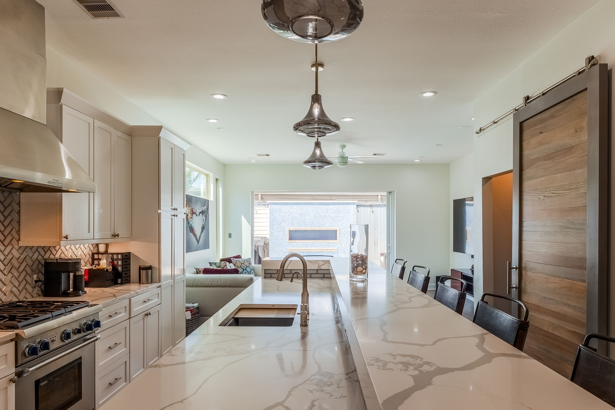 2124 Banks Street Houston, TX 77098 - Photo 7 of 46 a kitchen with stainless steel appliances granite countertop a sink a stove and a refrigerator