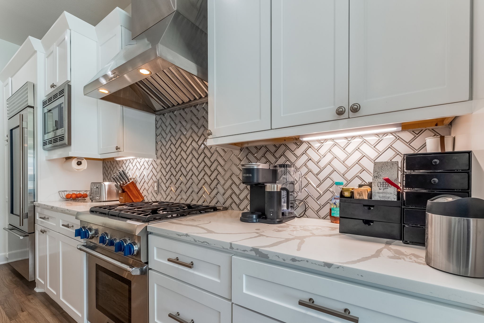 2124 Banks Street Houston, TX 77098 - Photo 8 of 46 a kitchen with stainless steel appliances granite countertop a sink and a stove