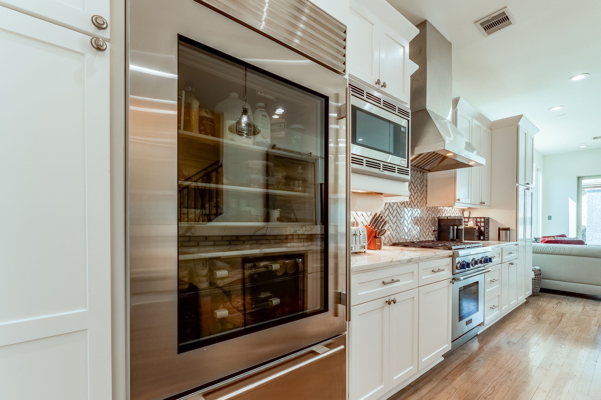 2124 Banks Street Houston, TX 77098 - Photo 9 of 46 a kitchen with stainless steel appliances granite countertop a stove and a refrigerator