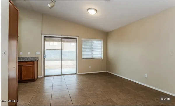 a kitchen with stainless steel appliances granite countertop a refrigerator stove and sink