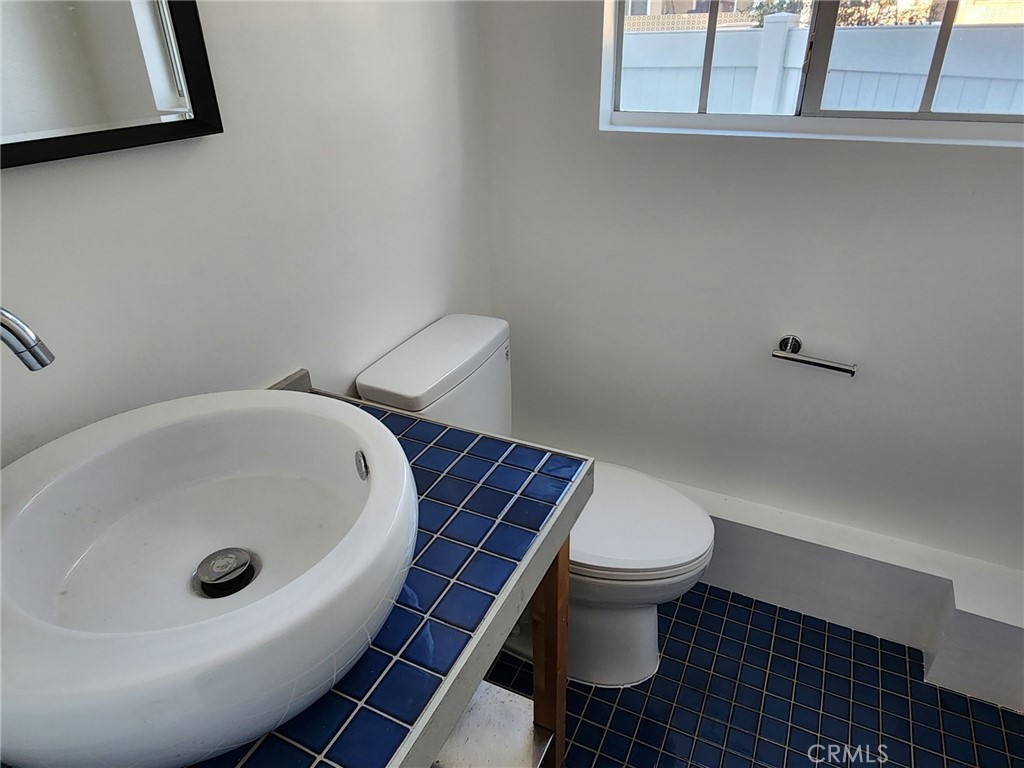 520 Claraday Street, Unit 1 Glendora, CA 91740 - Photo 12 of 16 a white toilet sitting next to a bathroom sink