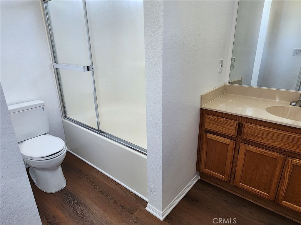 520 Claraday Street, Unit 1 Glendora, CA 91740 - Photo 10 of 16 a bathroom with a toilet a sink and a mirror