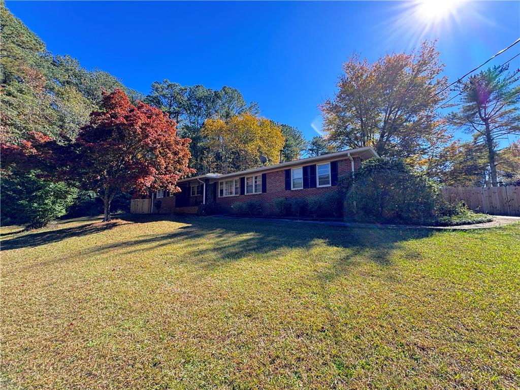 a view of a swimming pool with an outdoor space and seating area