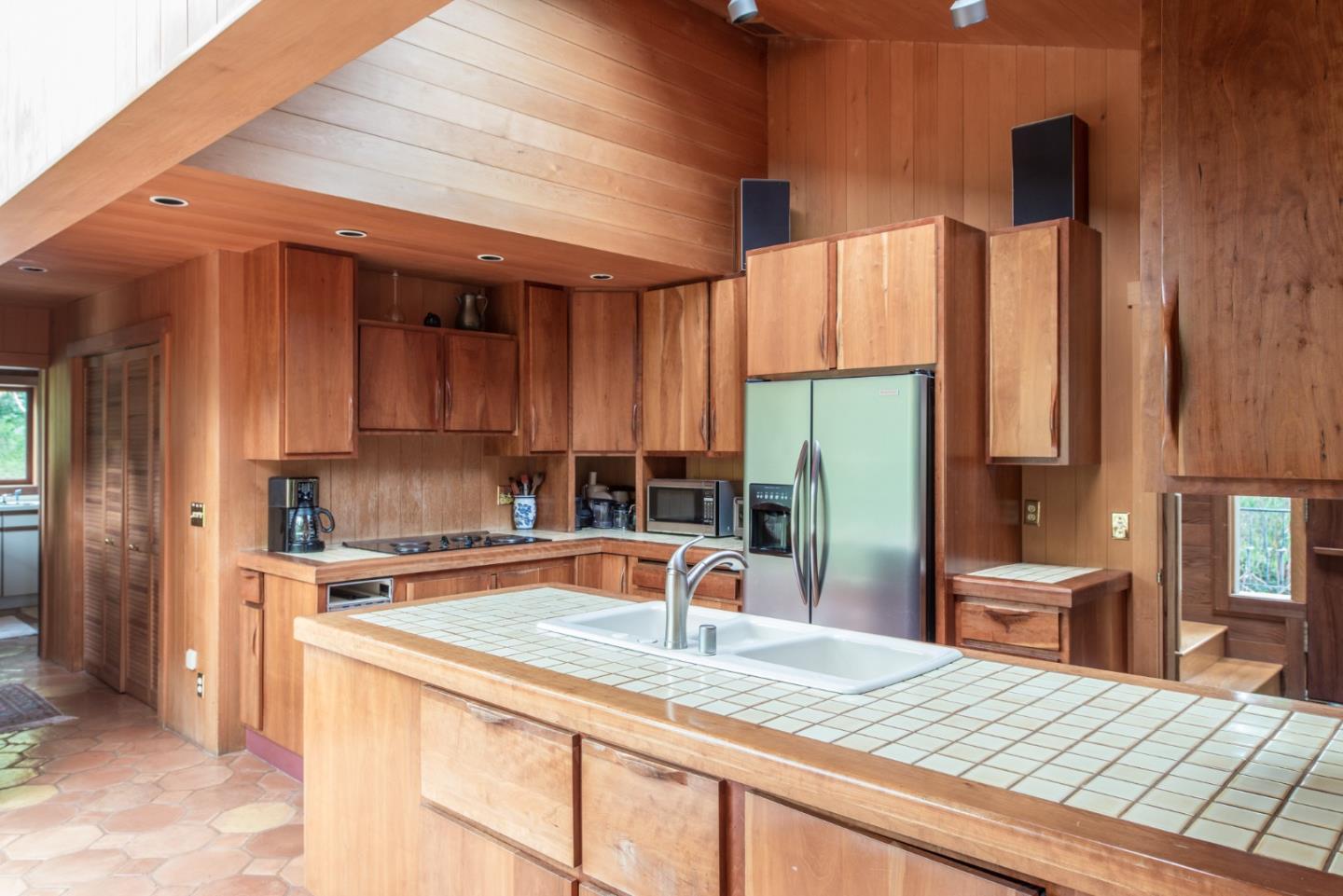 246 Highway 1 Carmel, CA 93923 - Photo 11 of 37 a kitchen with kitchen island a sink appliances and cabinets