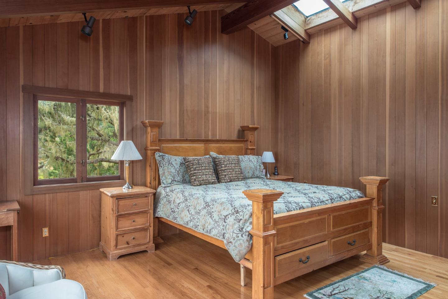 246 Highway 1 Carmel, CA 93923 - Photo 19 of 37 a bed sitting in a bedroom next to a window