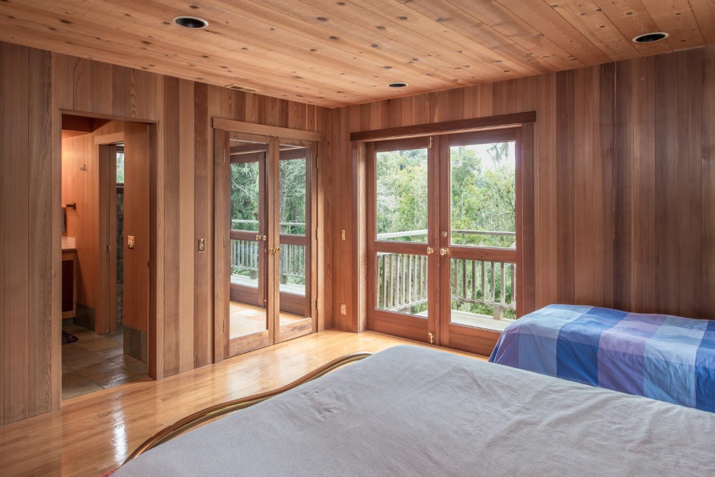 246 Highway 1 Carmel, CA 93923 - Photo 21 of 37 a bedroom with furniture and large windows