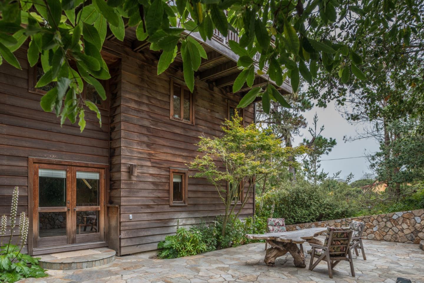 246 Highway 1 Carmel, CA 93923 - Photo 28 of 37 a backyard of a house with table and chairs