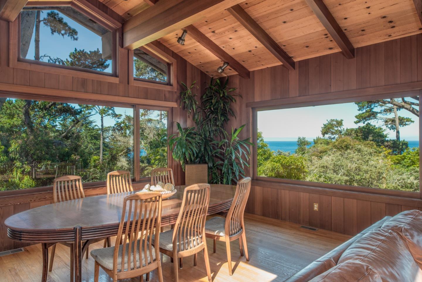246 Highway 1 Carmel, CA 93923 - Photo 3 of 37 a view of a patio with table and chairs with wooden floor and fence