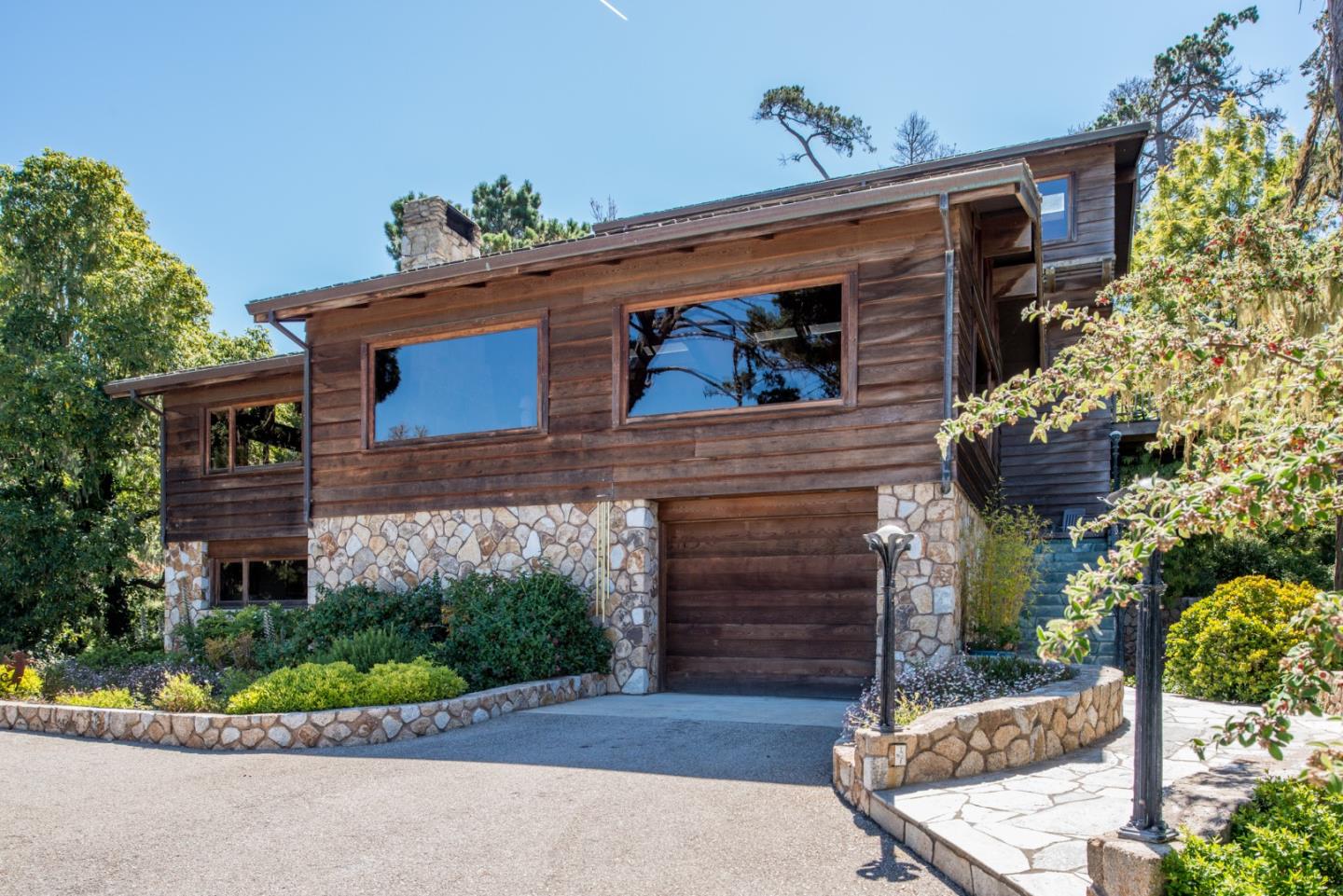 246 Highway 1 Carmel, CA 93923 - Photo 31 of 37 a front view of a house with a yard