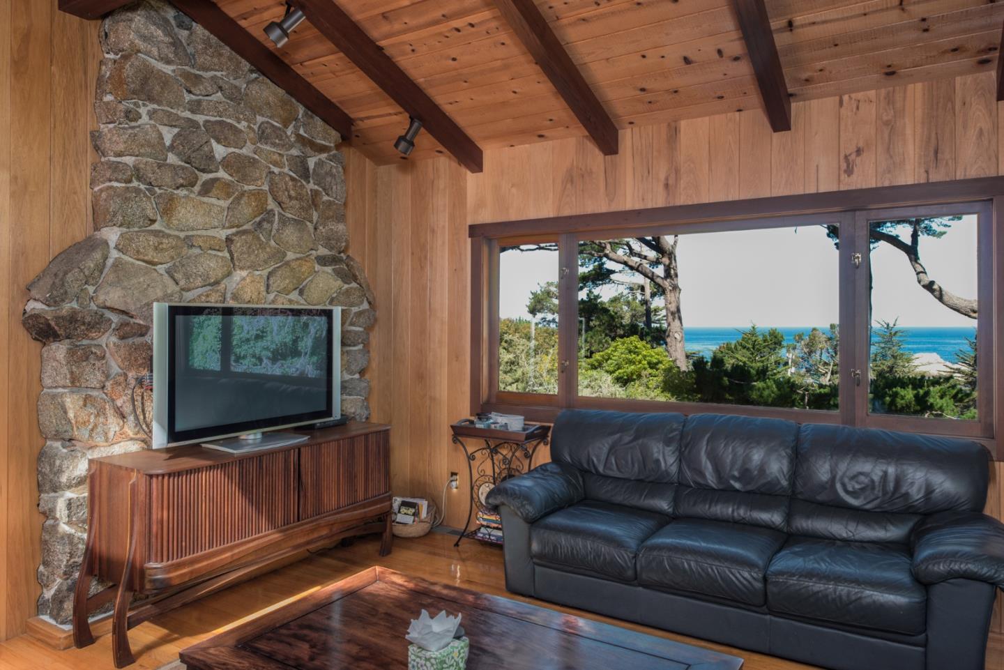 246 Highway 1 Carmel, CA 93923 - Photo 8 of 37 a living room with furniture and a flat screen tv