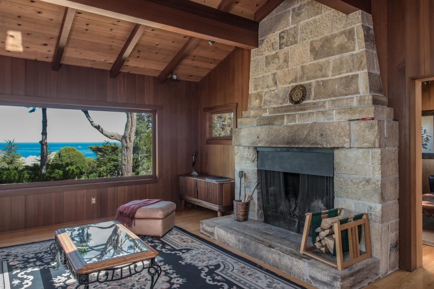 246 Highway 1 Carmel, CA 93923 - Photo 9 of 37 a living room with furniture and a fireplace