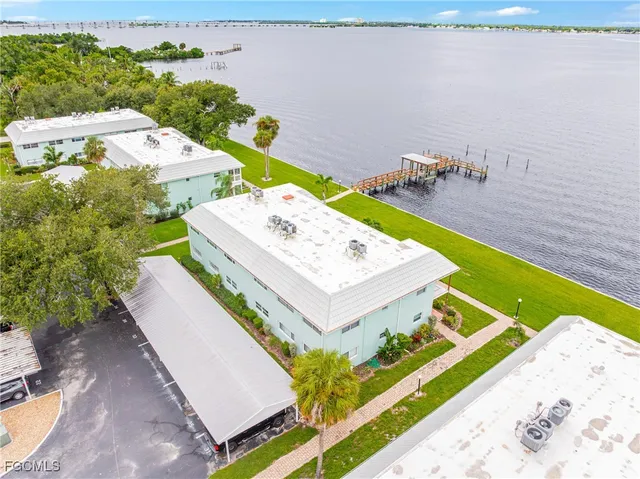 a view of an house with pool and a yard