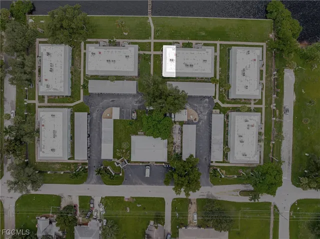 an aerial view of a house with a yard