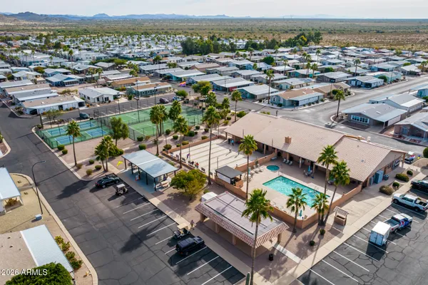 an aerial view of multiple houses with yard