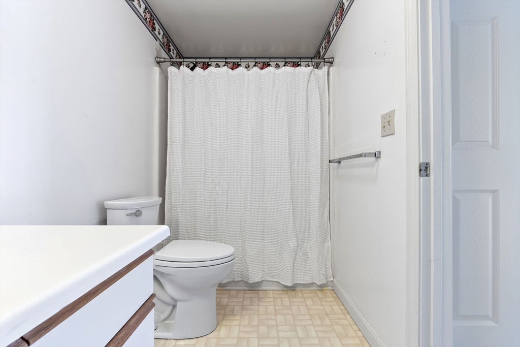 148 Main Street, Unit C538 North Andover, MA 01845 - Photo 18 of 23 a bathroom with a sink and a toilet