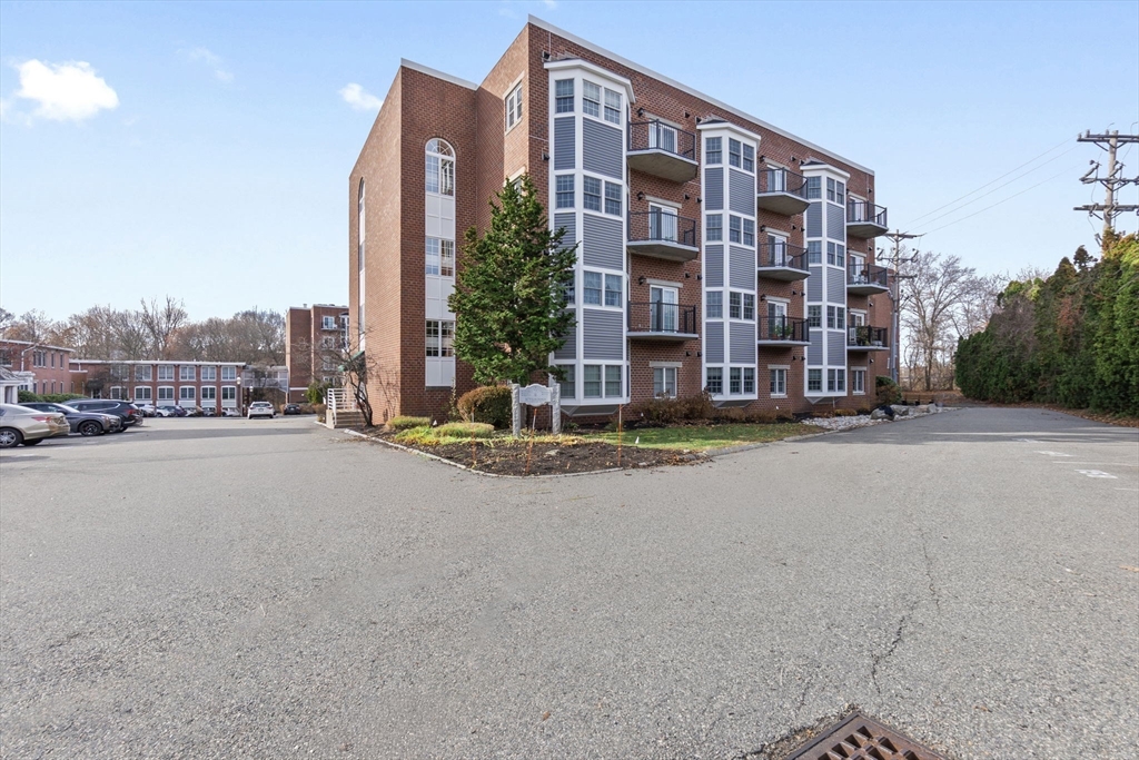 148 Main Street, Unit C538 North Andover, MA 01845 - Photo 2 of 23 a view of a tall building next to a road