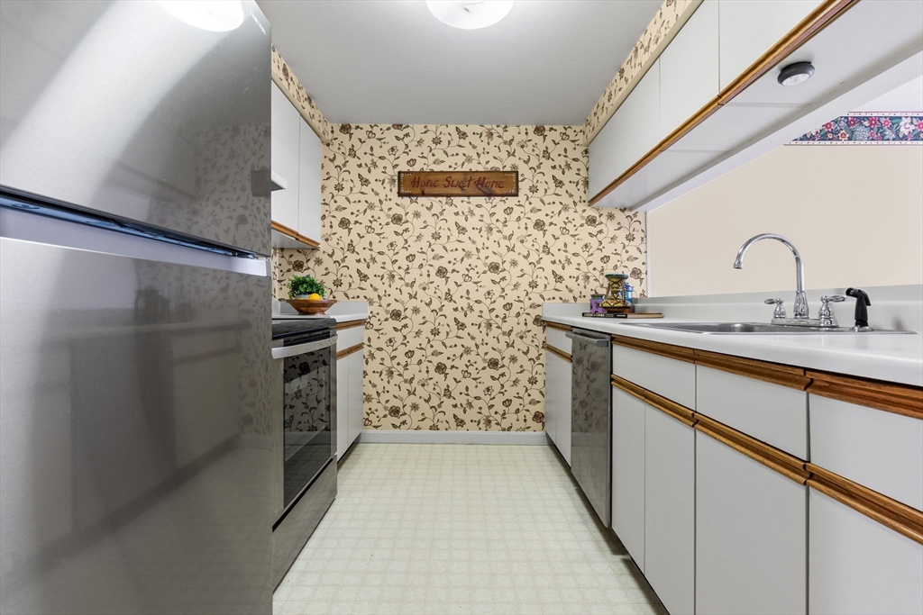 148 Main Street, Unit C538 North Andover, MA 01845 - Photo 3 of 23 a bathroom with a sink and a mirror