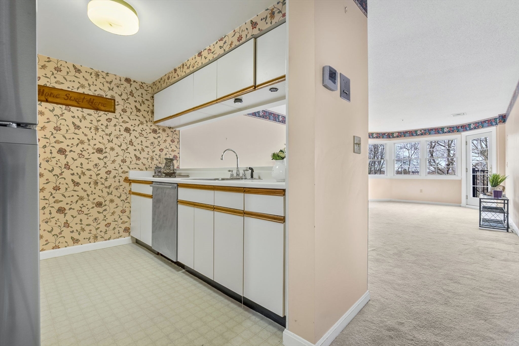 148 Main Street, Unit C538 North Andover, MA 01845 - Photo 4 of 23 a bathroom with a sink and a mirror