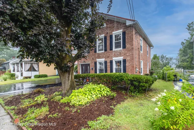 a front view of a house with a garage