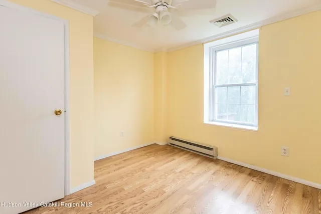 a view of a room with a window