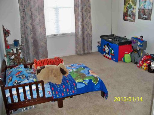 254 Cassidy Lane Elgin, IL 60124 - Photo 5 of 10 a bedroom with a bed and window