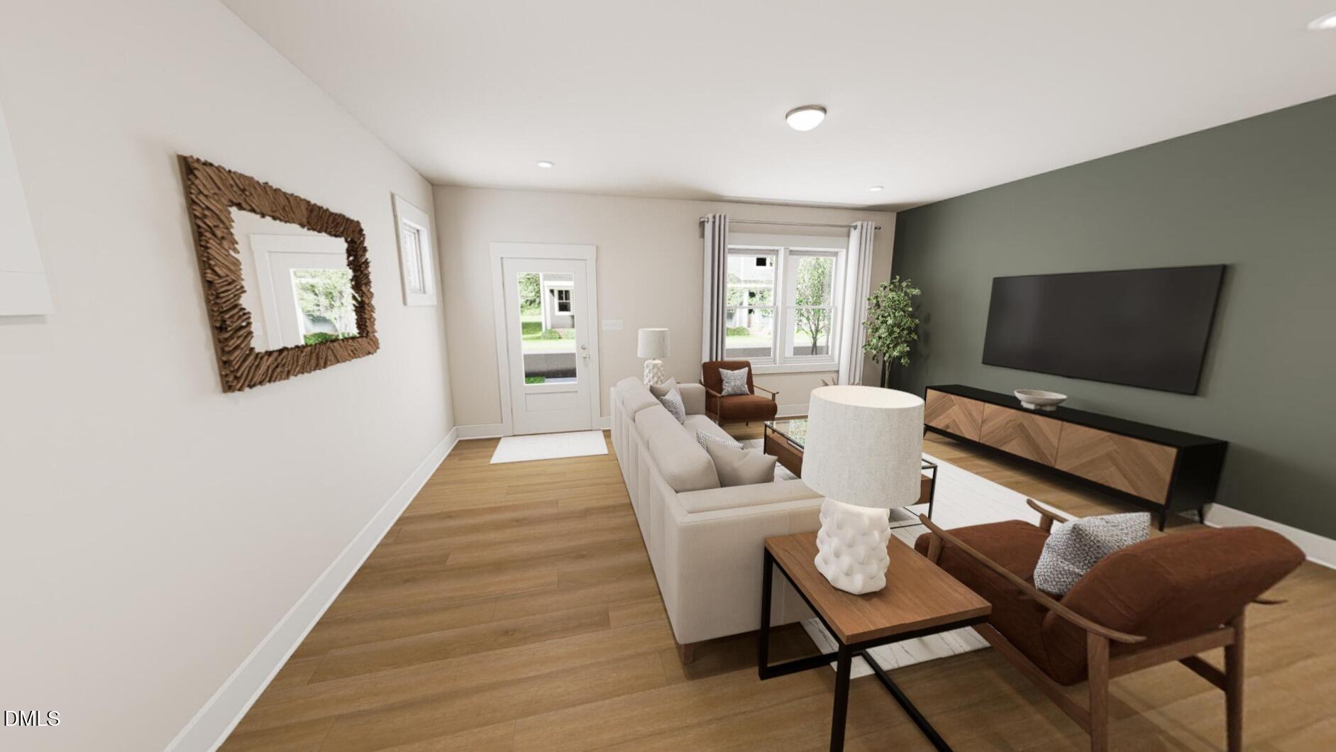 545 Folk Song Way Wendell, NC 27591 - Photo 4 of 27 a living room with furniture and a flat screen tv