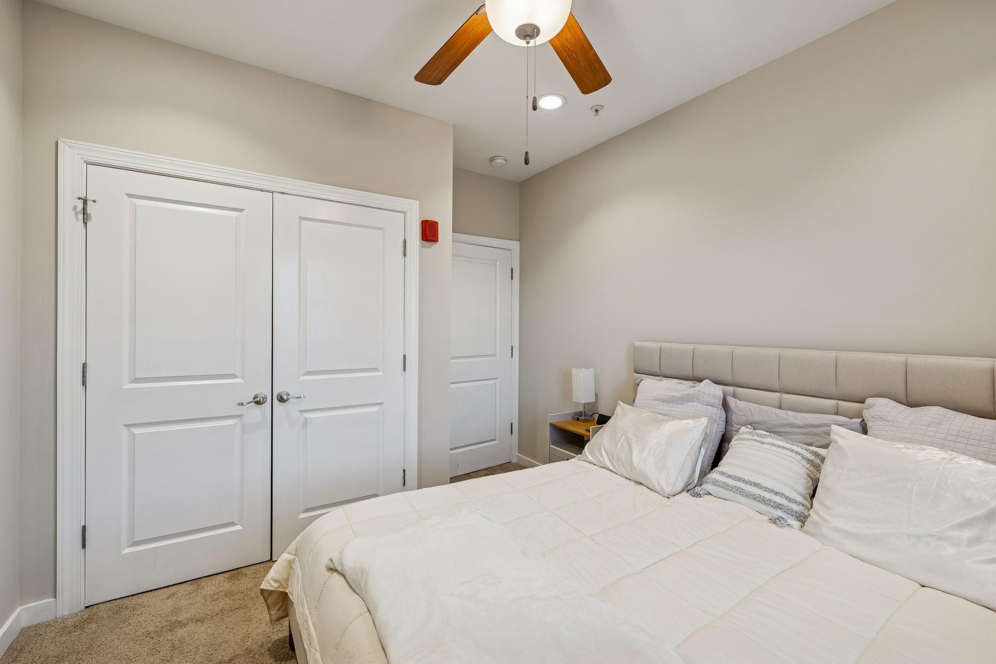 1319 West Main Street, Unit 303 Franklin, TN 37064 - Photo 11 of 23 a bedroom with a large bed and a chandelier