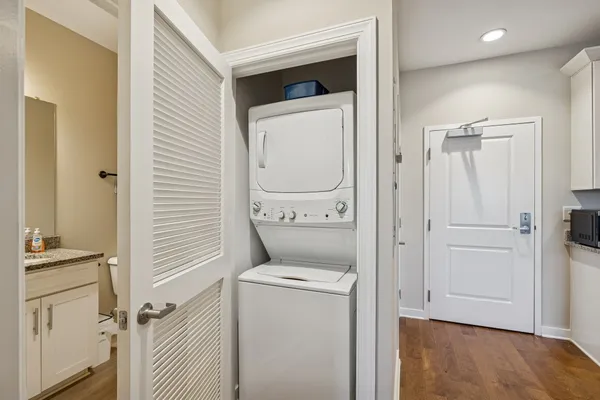 a view of bathroom with a washer and dryer