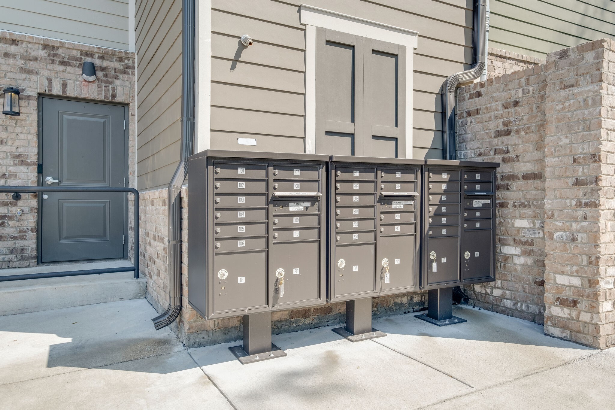 1319 West Main Street, Unit 303 Franklin, TN 37064 - Photo 16 of 23 a front view of a building with a glass door