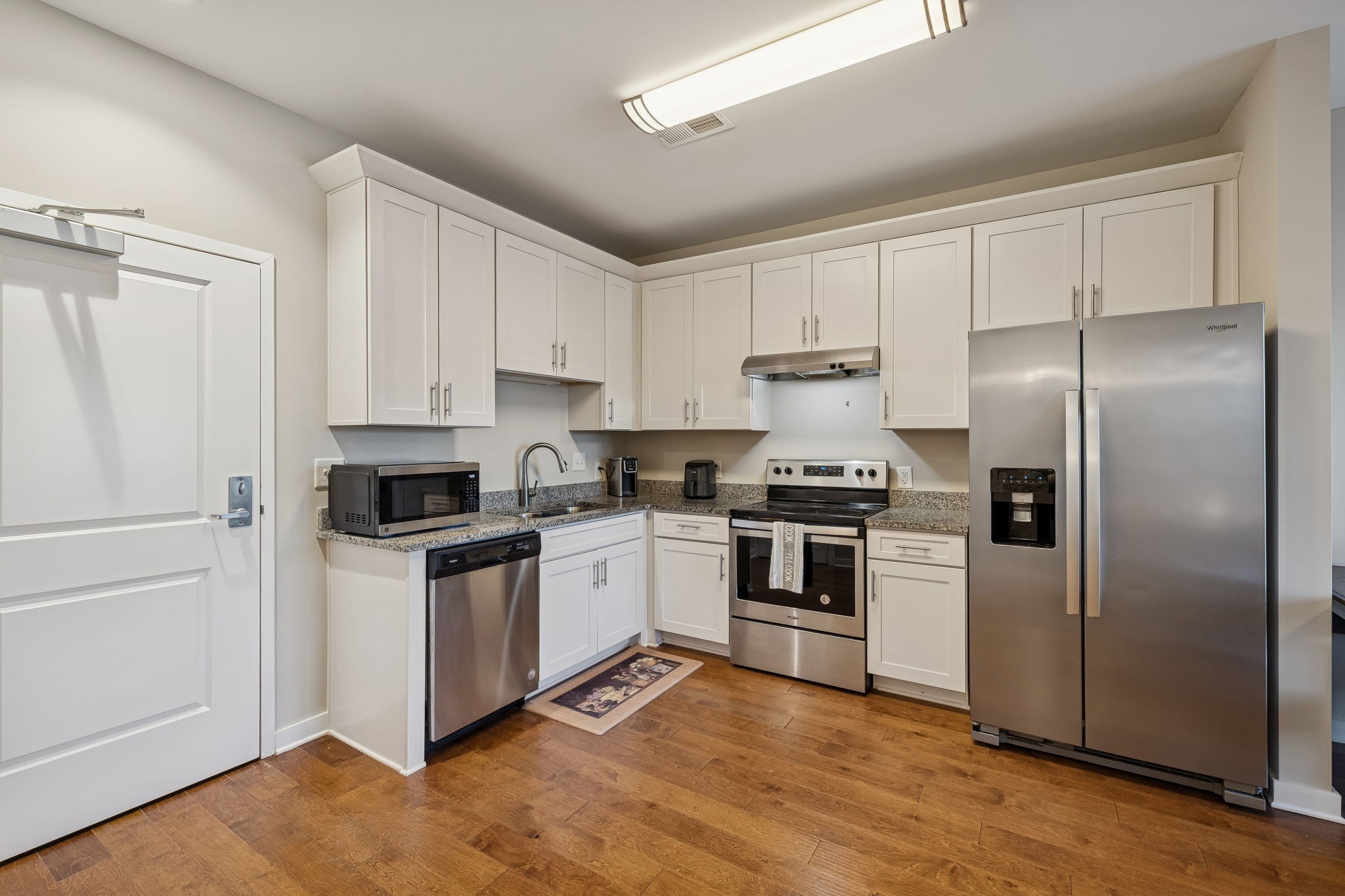 1319 West Main Street, Unit 303 Franklin, TN 37064 - Photo 4 of 23 a kitchen with cabinets stainless steel appliances and a window