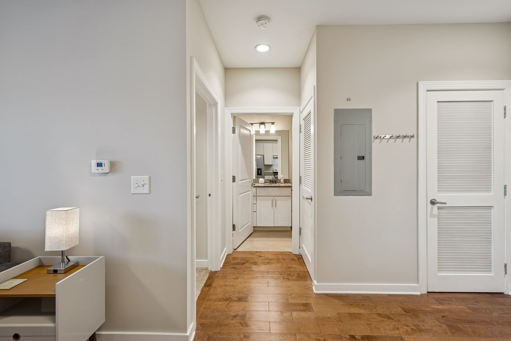 1319 West Main Street, Unit 303 Franklin, TN 37064 - Photo 7 of 23 a view of a hallway with wooden floor and a bathroom