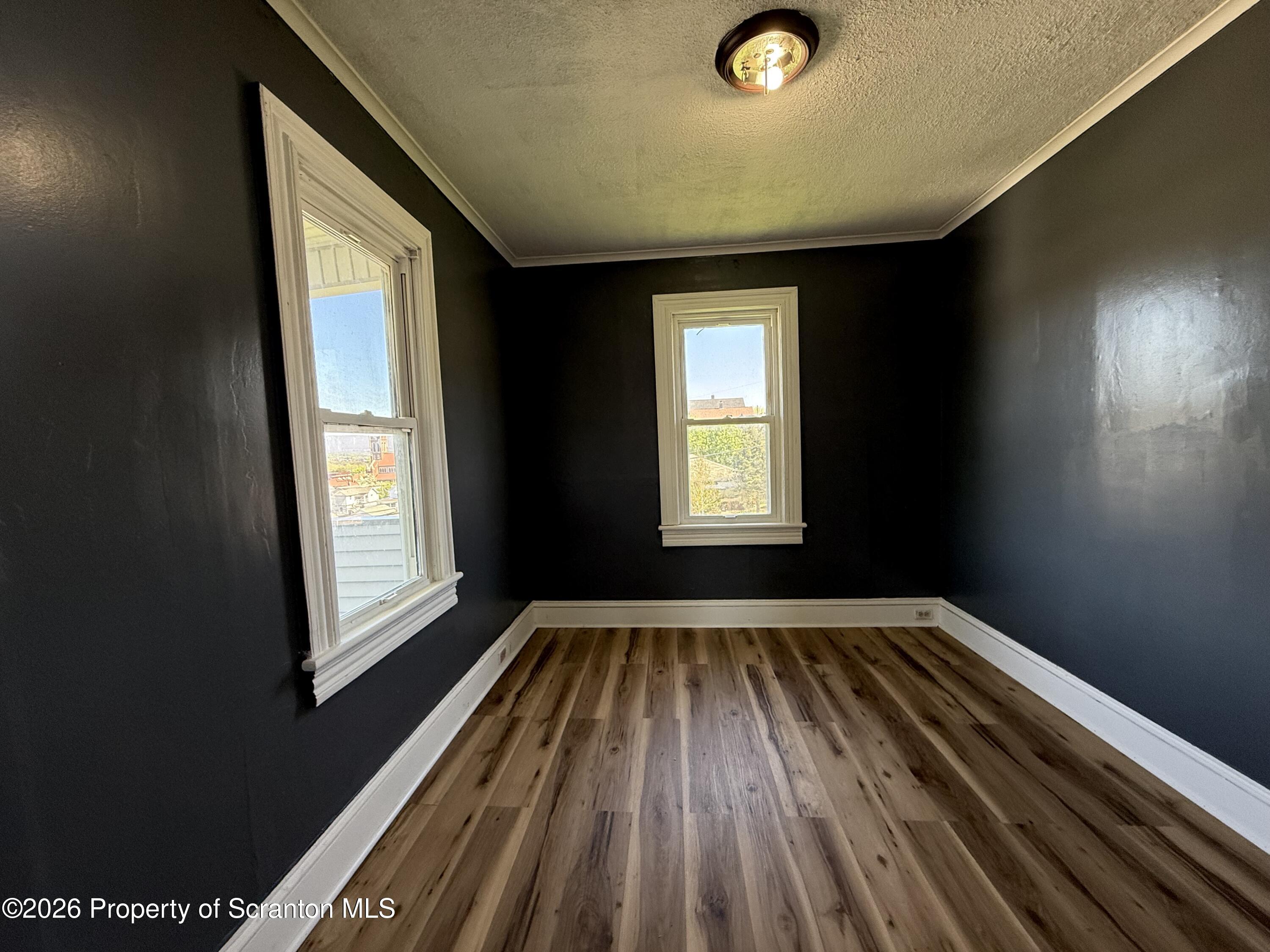 1706 Prospect Avenue, Unit 2 Scranton, PA 18505 - Photo 11 of 16 a view of empty room with wooden floor and fan
