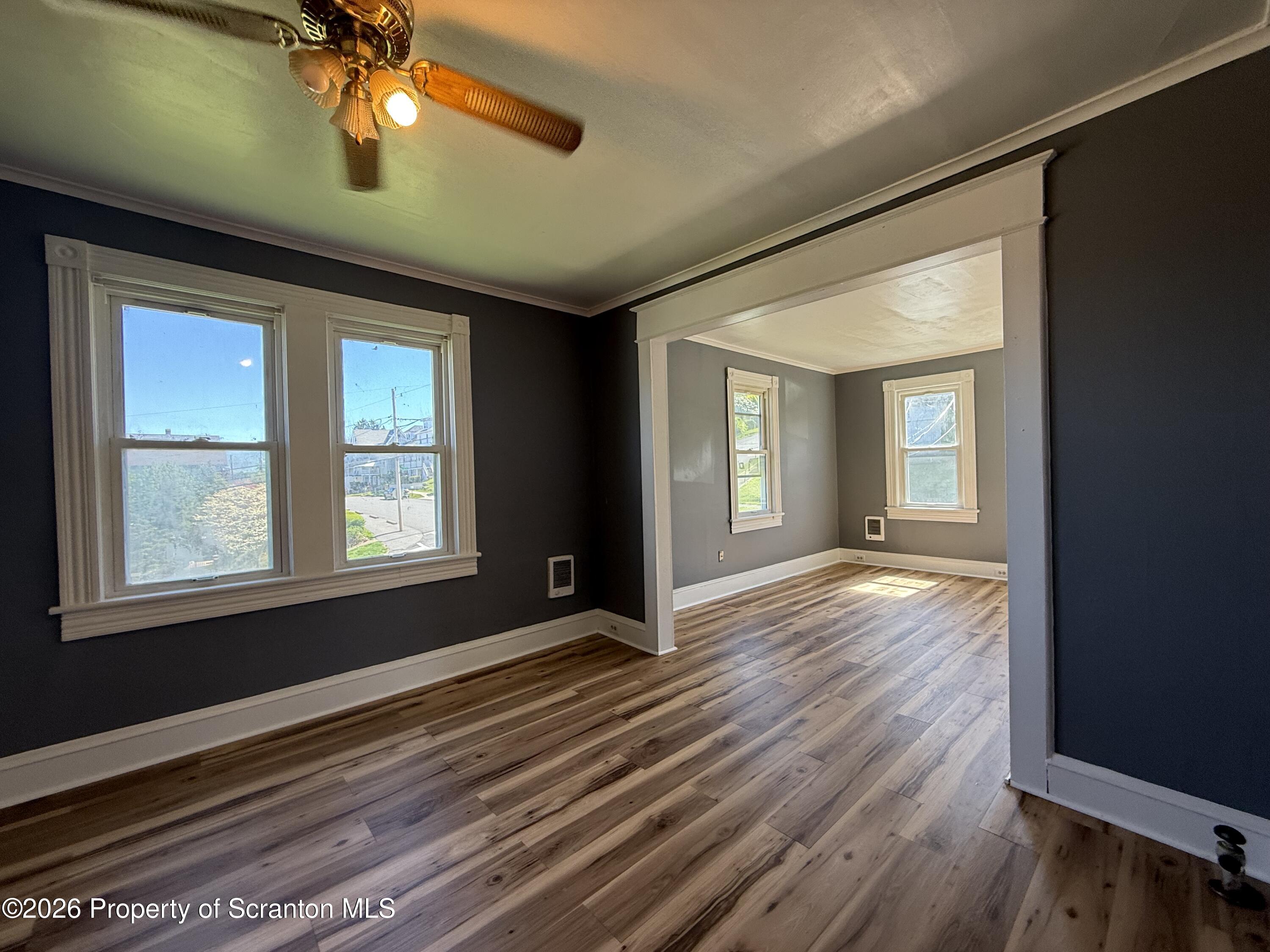 1706 Prospect Avenue, Unit 2 Scranton, PA 18505 - Photo 15 of 16 a view of an empty room with wooden floor and a window