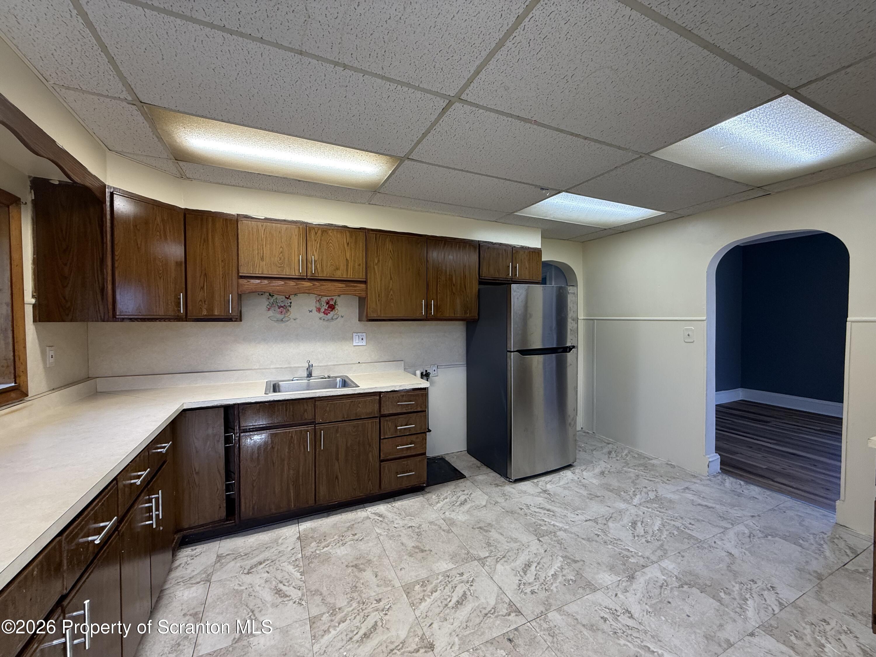 1706 Prospect Avenue, Unit 2 Scranton, PA 18505 - Photo 5 of 16 a kitchen with stainless steel appliances granite countertop a refrigerator and a sink