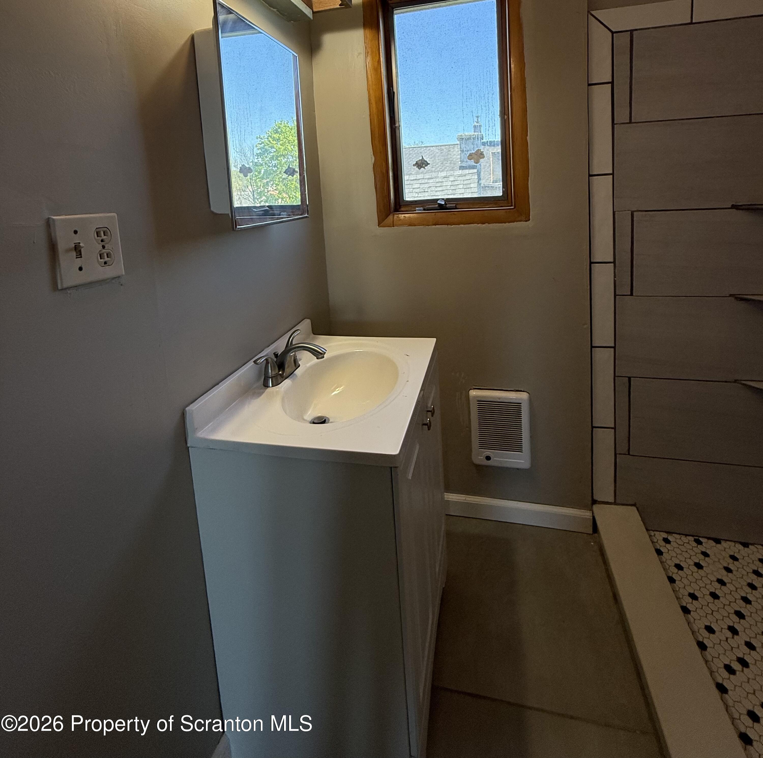 1706 Prospect Avenue, Unit 2 Scranton, PA 18505 - Photo 7 of 16 a bathroom with a sink and a mirror