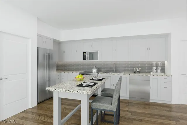 a kitchen with a table and chairs