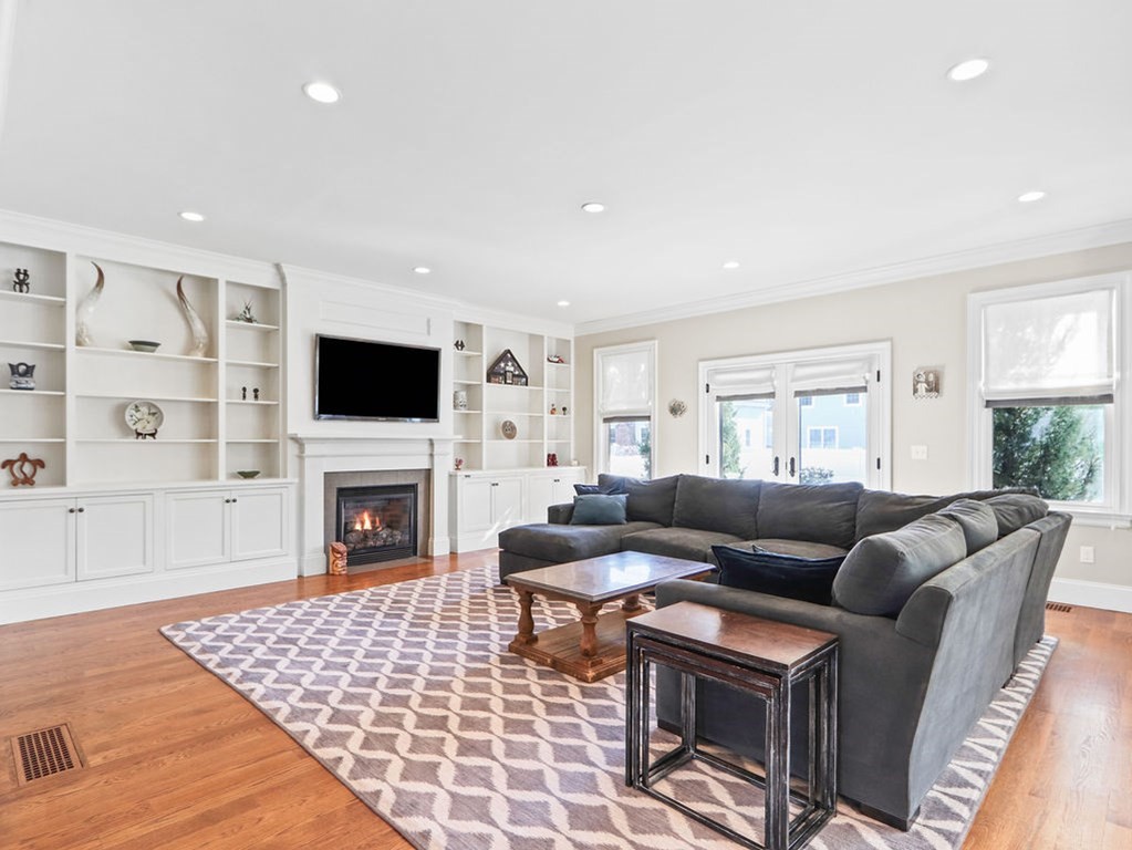 78 Mayflower Road Needham, MA 02492 - Photo 3 of 30 a living room with furniture and a fireplace