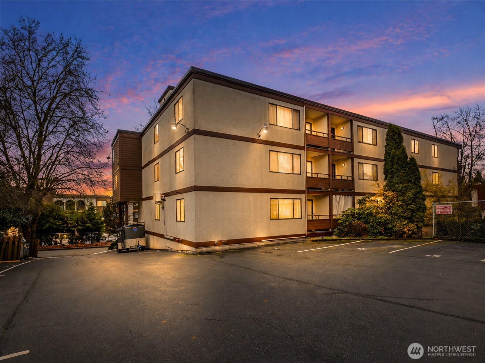2100 North 106th Street, Unit 307 Seattle, WA 98133 - Photo 10 of 11 a street view along with residential buildings
