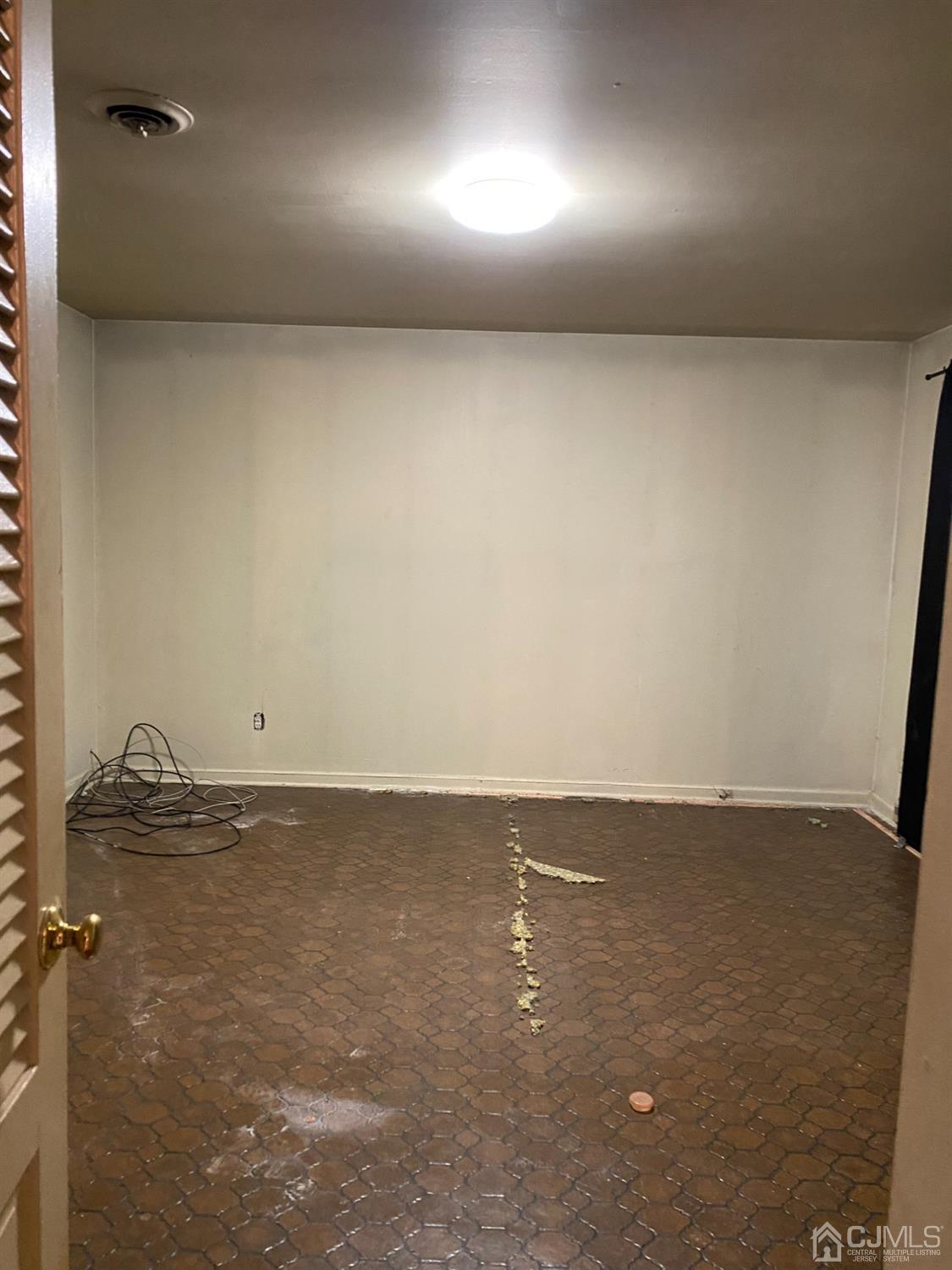 230 Austin Road Orange, NJ 07050 - Photo 11 of 34 an empty room with a bench